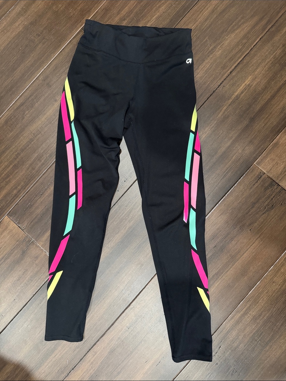 GAPfit girls activewear.   Black Leggings with Pink, Teal & Yellow Side Panels
